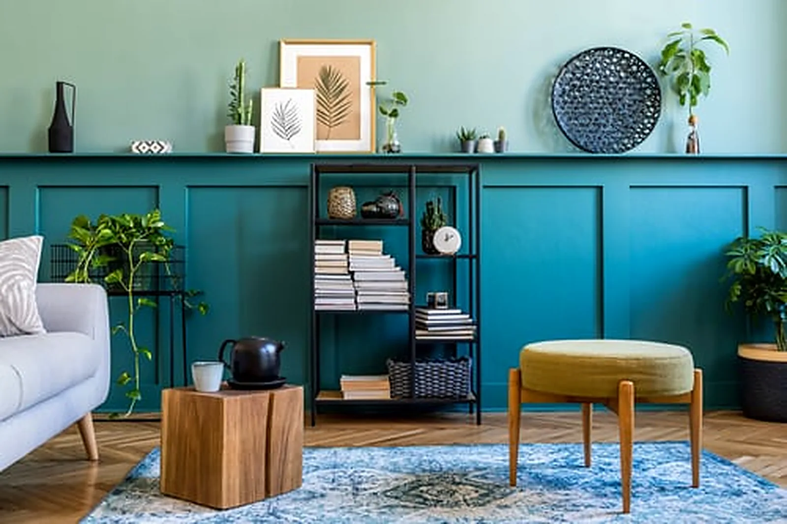 Deep teal paneled living room wall with a flawless interior paint finish in a modern Berkeley home