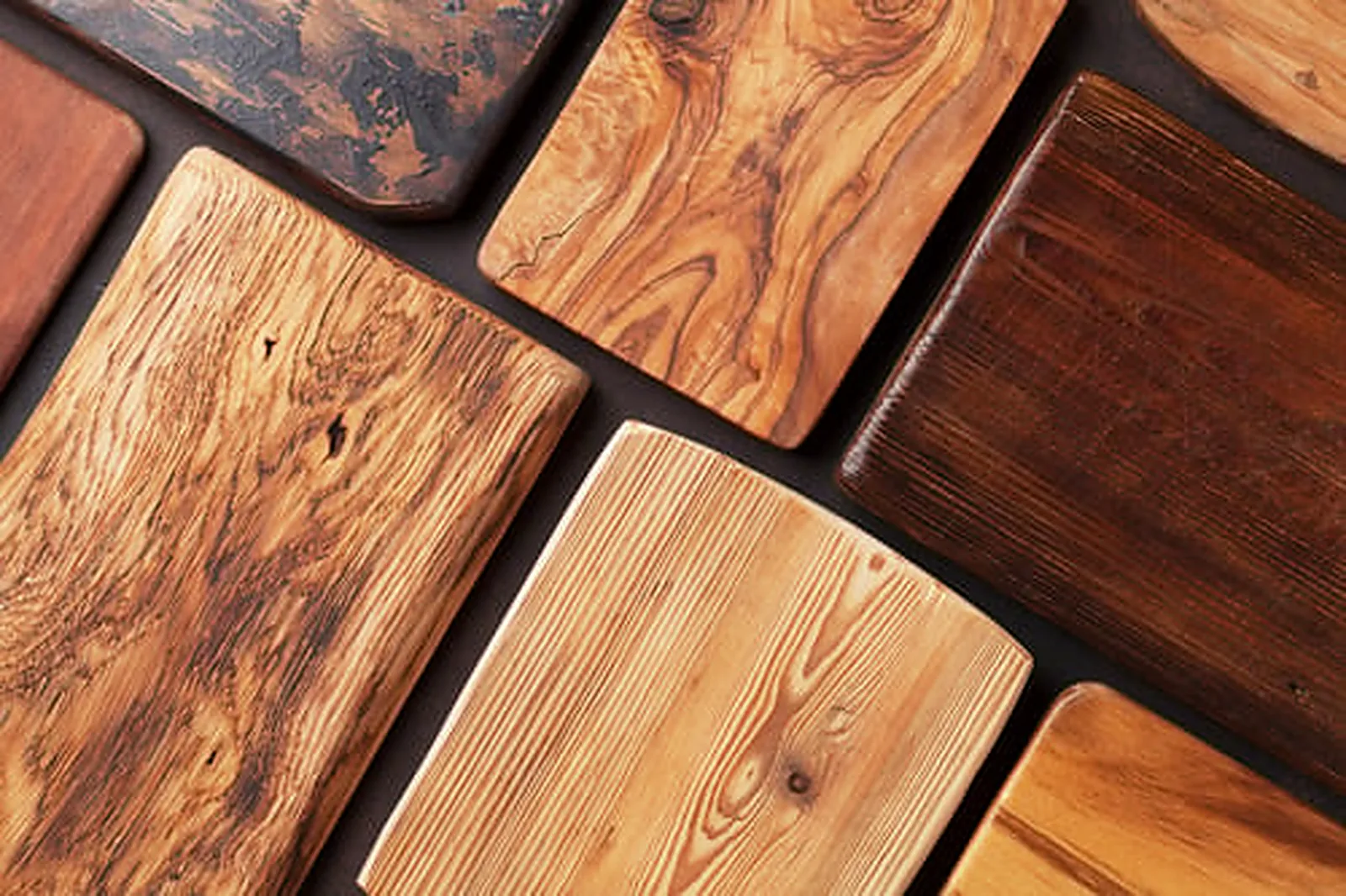 Restored wood panels in varied grains and stain finishes from professional wood restoration and refinishing